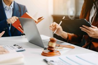 lawyers-discussing-a-contract-with-technology-2026-03-11-00-49-12-utc_11zon